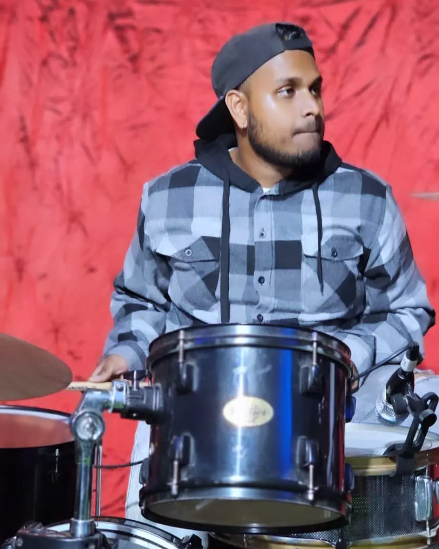 Revon, teacher, playing drums